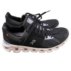 On Running Black and White Athletic Shoes with CloudTec Sole